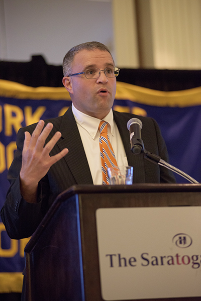 Dr. James C. Brown at podium at NYSACOP