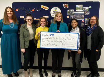 Representatives from Excellus BlueCross BlueShield present Health Equity Award to Young Scholars LPP of Utica University.