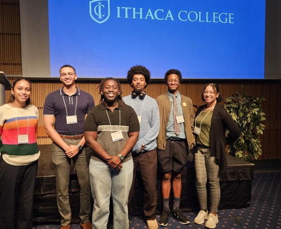 Yamilet Tavarez, Belier Javier, Brian Kusi, Xavier Moore, Jallen Wright, and Kira Maddox stand together at the 2024 CNY LSAMP Symposium.