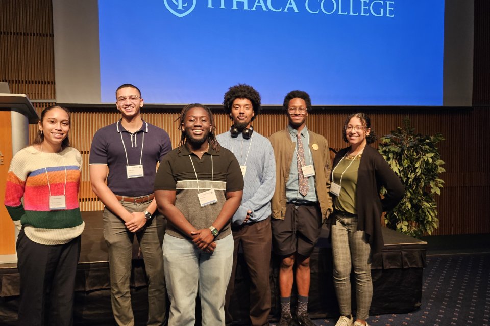 Yamilet Tavarez, Belier Javier, Brian Kusi, Xavier Moore, Jallen Wright, and Kira Maddox stand together at the 2024 CNY LSAMP Symposium.